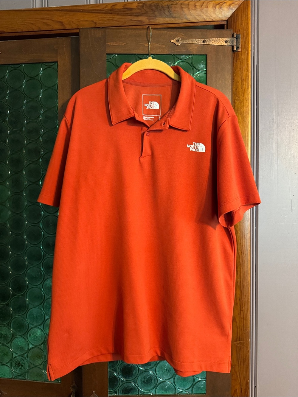 The North Face Men's Bright Orange Polo Shirt with Embroidered Logo